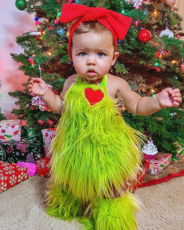 Grinchmas baby romper set with fuzzy green romper, red heart, matching leg warmers and red bow headband