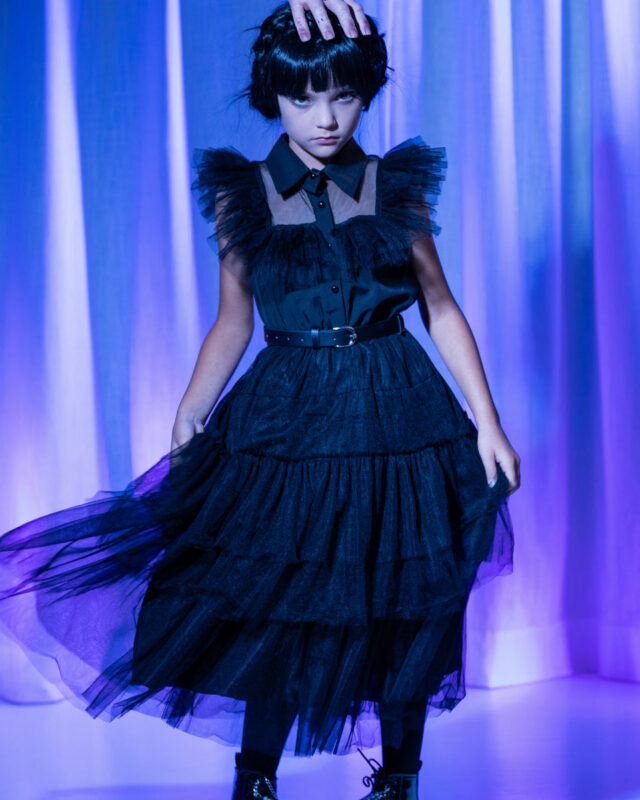 Shop our Wednesday Addams costume for girls featuring a spooky Nevermore-inspired black dress and accessories. Perfect for Halloween, parties and dress-up.